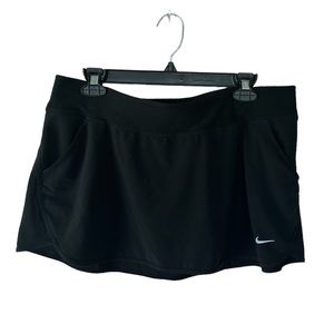 Nike black mini tennis skirt size large in Like- new condition.